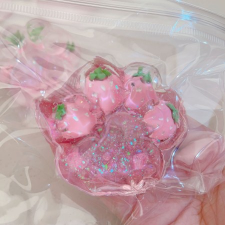 Jucarie Antistres Squishy, Flippy, cu Revenire Lenta, Model Labuta de Pisica cu Sclipici, 6.5x6 cm, 60g, Ambalaj Transparent, Roz