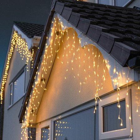 Instalatie Craciun Tip Franjuri/Turturi, lungime 12 m, 300 LED-uri, Prelungitor 1.5 m, Conectare la Retea, Fir transparent, Alb Cald