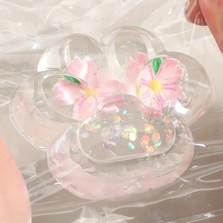 Jucarie Antistres Squishy, Flippy, Labuta de Pisica Pufoasa, cu Revenire Lenta, 7 x 6.5 cm, Model Flori 2, Transparent