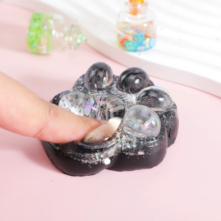 Jucarie Antistres Squishy, Flippy, cu Revenire Lenta, Model Cat Paw, 6.5 x 6 cm, din Tpr, 4-6 Ani, Model 2 Figurine, Negru cu Insertii