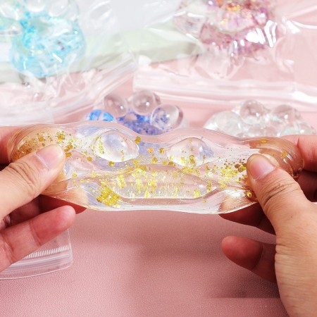 Jucarie Antistres Squishy, Flippy, cu Revenire Lenta, Model Cat Paw, 6.5 x 7 cm, din Tpr, 4-6 Ani, Model 4 Sclipici, Transparent