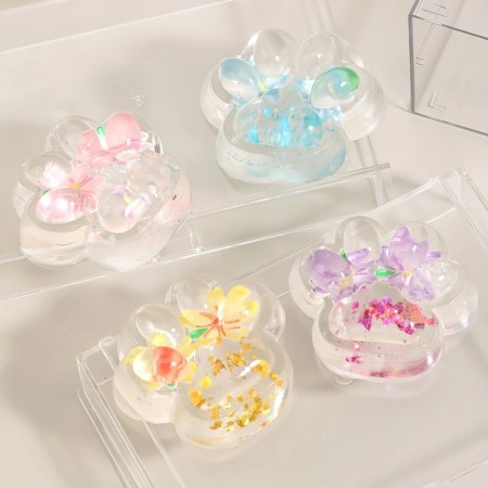 Jucarie Antistres Squishy, Flippy, Labuta de Pisica Pufoasa, cu Revenire Lenta, 7 x 6.5 cm, Model Flori 2, Transparent