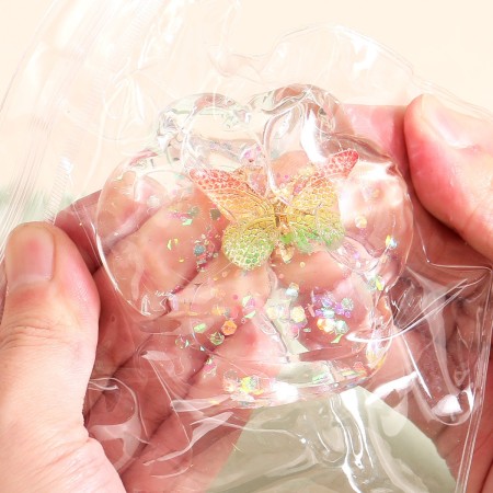Jucarie Antistres Squishy, Flippy, Labuta de Pisica Pufoasa, cu Revenire Lenta, 7 x 6.5 cm, Model Fluturi, Multicolor