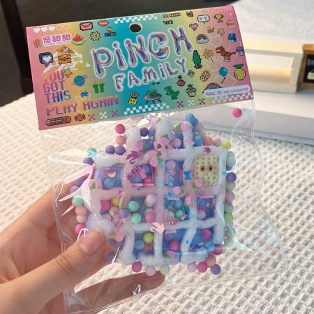 Jucarie Antistres Squishy, Flippy, cu Revenire Lenta, Model Waffle, 6x6 cm, 99g, Ambalaj Transparent, Multicolor