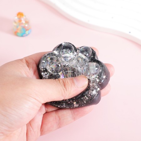 Jucarie Antistres Squishy, Flippy, cu Revenire Lenta, Model Labuta de Pisica cu Sclipici, 6.5x6 cm, 60g, Ambalaj Transparent, Alb-Negru
